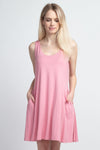 pink open back dress with pockets